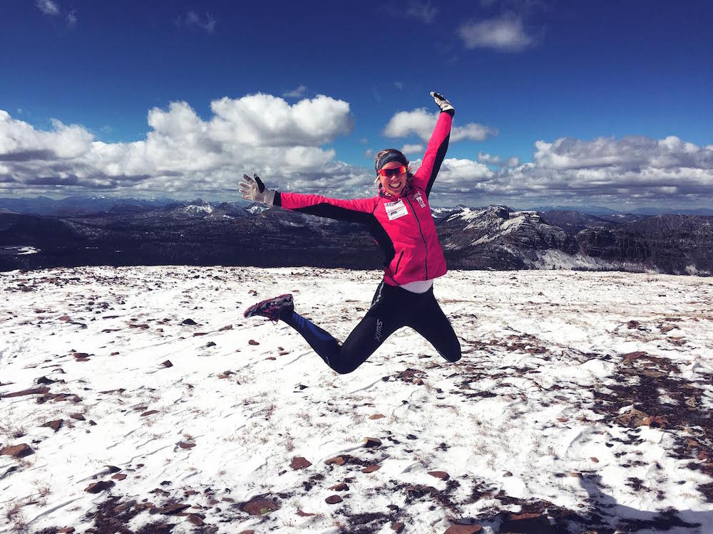 Dahria Beatty celebrating at snowy peak during an overdistance run near Park City (Courtesy Photo)