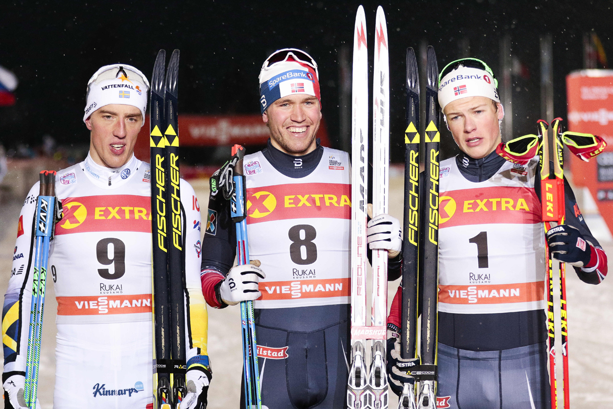 The men's classic sprint podium in the first World Cup race of the season on Saturday in Kuusamo, Finland, with Norway's Pål Golberg (c) in first, Sweden's Calle Halfvarsson (l) in second, and Norway's 20-year-old Johannes Klaebo (r) in third. (Photo: Fischer/NordicFocus)
