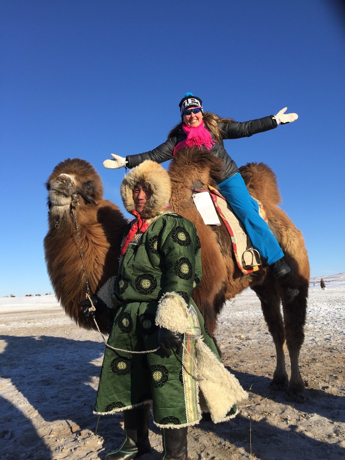 Holly Brooks (retired APU and U.S. Ski Team) rides a camel during the 2016 China Tour de Ski. (Photo: courtesy Holly Brooks)