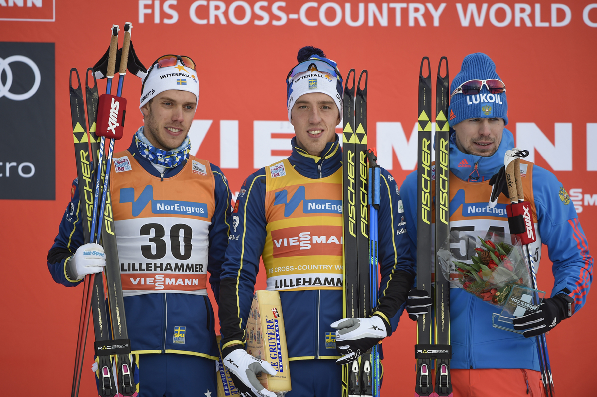 The men's 10 k freestyle podium at the Lillehammer World Cup, with Sweden taking the top two with winner Calle Halfvarsson (c) and runner-up Marcus Hellner (l) and Russia's Sergey Ustiugov in third. (Photo: Fischer/NordicFocus)