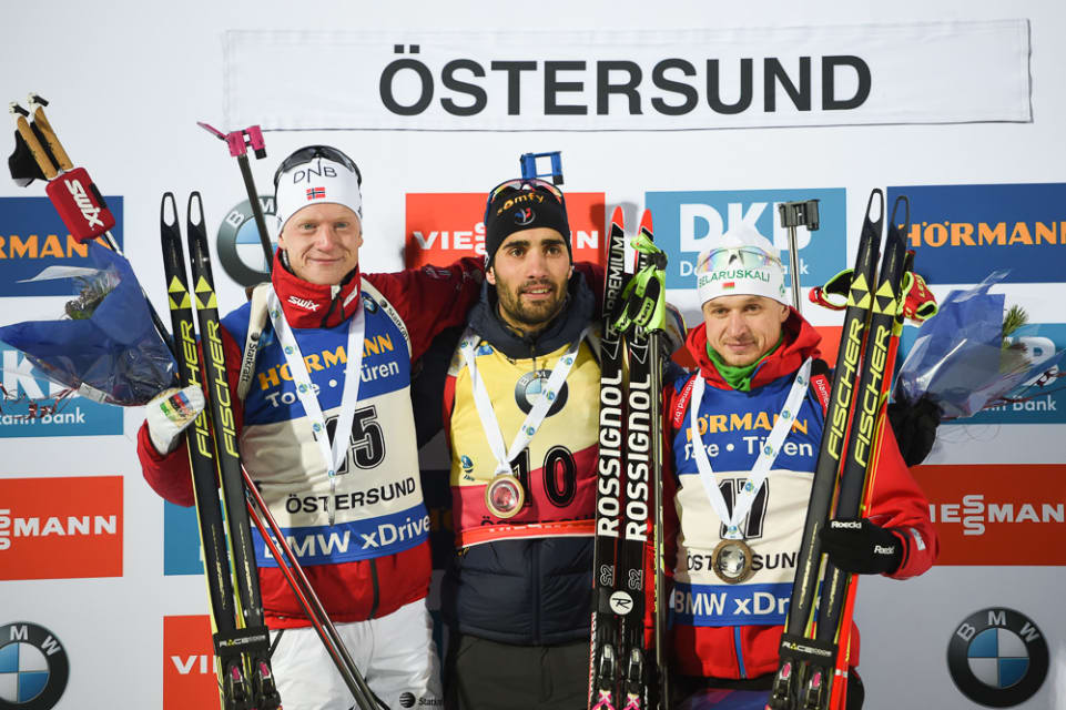 The men's 20 k individual podium in the first IBU World Cup of the 2016/2017 season, with winner Martin Fourcade (c) of France, Norway's Johannes Bø (l) in second and Vladimir Chepelin (r) of Belarus on the podium for the first time in third. (Photo: IBU/BiathlonWorld.com)