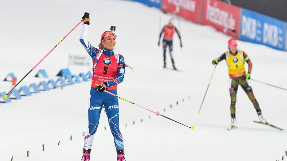 Gabriela Koukalová of the Czech Republic looks to her home crowd as she wins the women's 12.5 k mass start on Sunday at the IBU World Cup in Nove Mesto, Czech Republic. She fended off Germany's Laura Dahlmeier (r), who took second. (Photo: IBU)