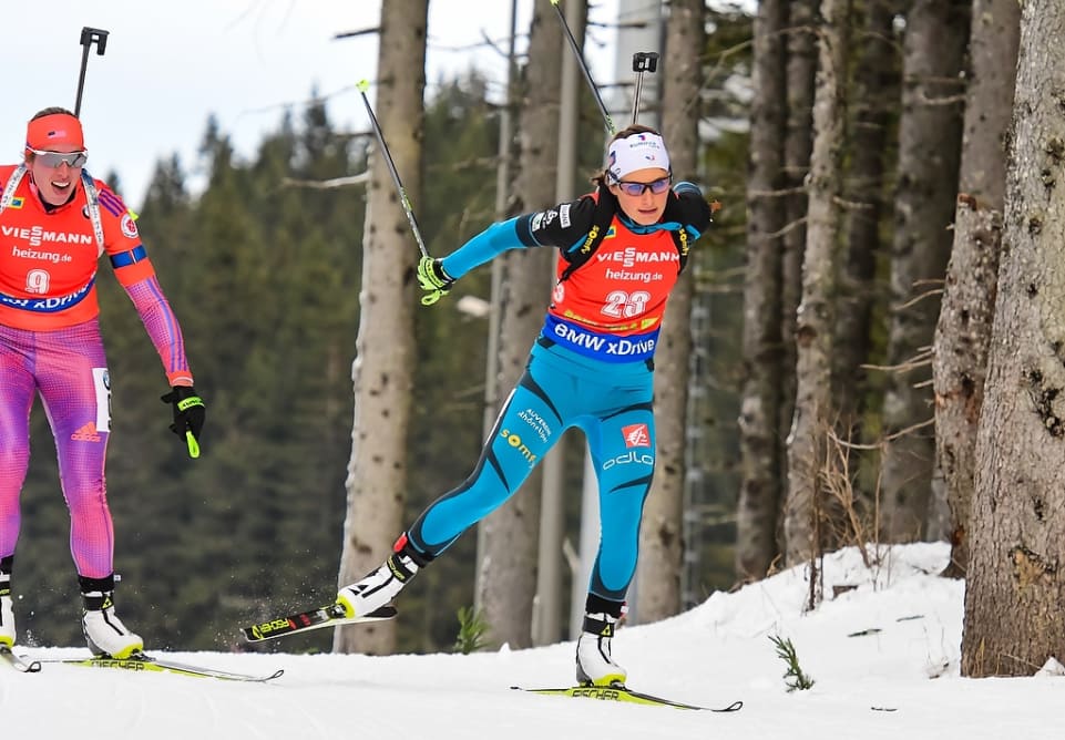 France's Justine Braisaz (r) racing to second in the women's 7.5 k sprint on Friday at the IBU World Cup in Pokljuka, Slovenia. American Susan Dunklee (l) finished 11th after initially leading at the finish. (Photo: IBU)