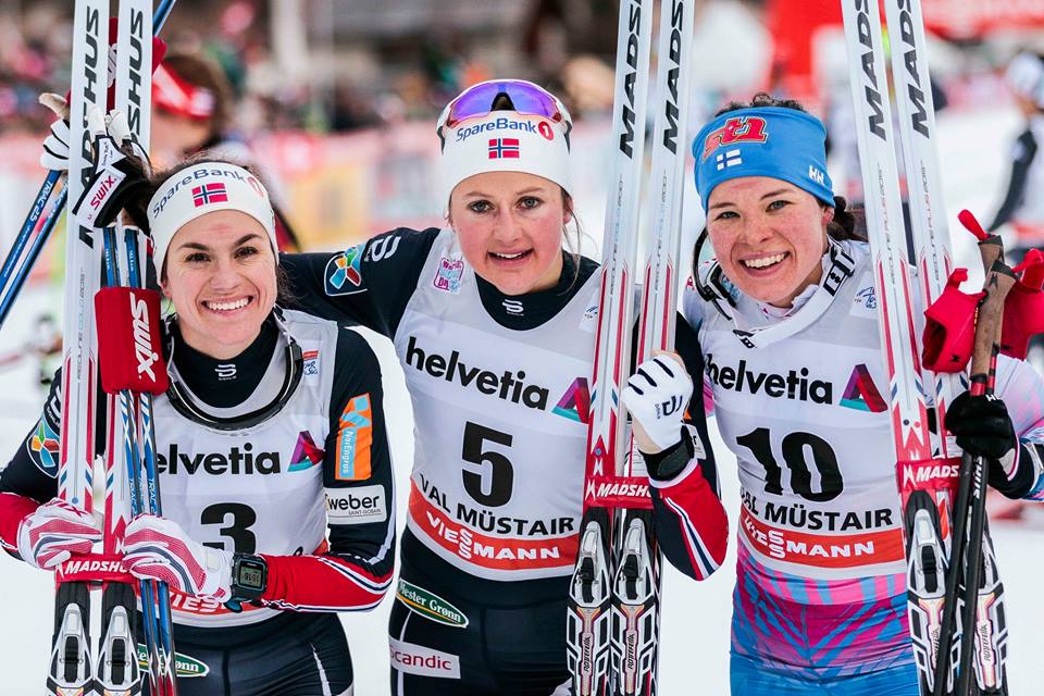 Left to right: Norwegians Heidi Weng and Ingvild Flugstad Østberg along with Finland's Krista Pärmäkoski on the podium for the women's 5-kilometer classic mass start on Sunday, Jan. 1 2017 in Val Müstair, Switzerland. (Photo: Fischer/Nordic Focus)