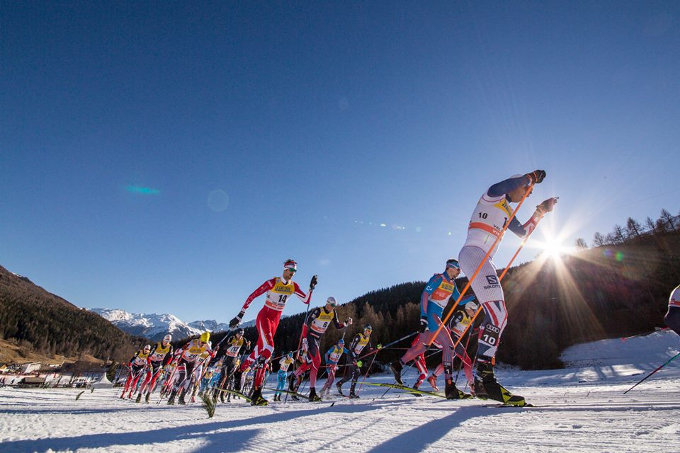 Canada's Len Valjas (in red) striding near Russia's Sergey Ustiugov (second from r, in blue) in Sunday's 10 k classic mass start at Stage 2 of the Tour de Ski in Val Mustair, Switzerland. According to Valjas's teammate Alex Harvey, most of the top skiers chose to stride rather than double pole, but Great Britain's Andrew Young (r) was among those double poling on skate skis. He ended up 50th, while his teammate Andrew Musgrave double poled to 17th. (Photo: Fischer/NordicFocus)