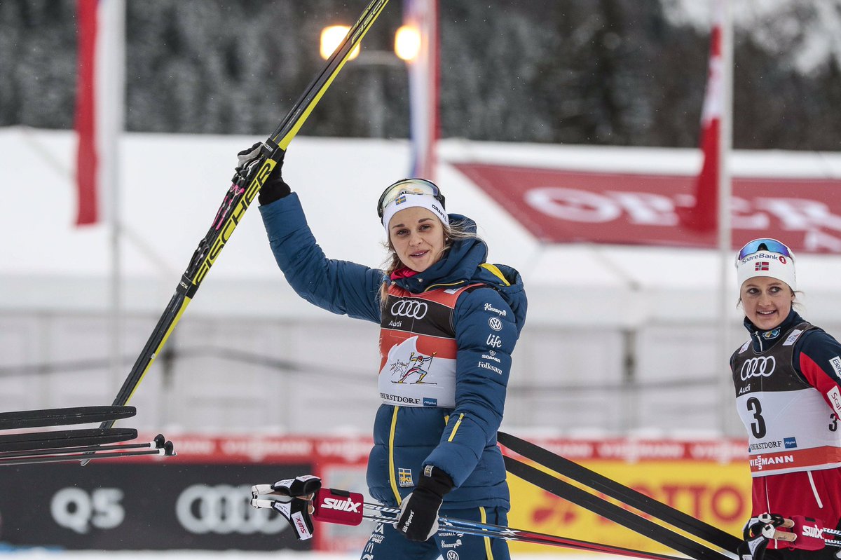 Sweden's Stina Nilsson celebrates her 10 k freestyle pursuit victory in Stage 4 of the Tour de Ski in Oberstdorf, Germany, which she won by 1.7 seconds ahead of Norway's Heidi Weng (not pictured in second) and 1.8 seconds ahead of Norway's Ingvild Flugstad Østberg (r) in third. (Photo: FIS Cross Country/NordicFocus via Twitter)