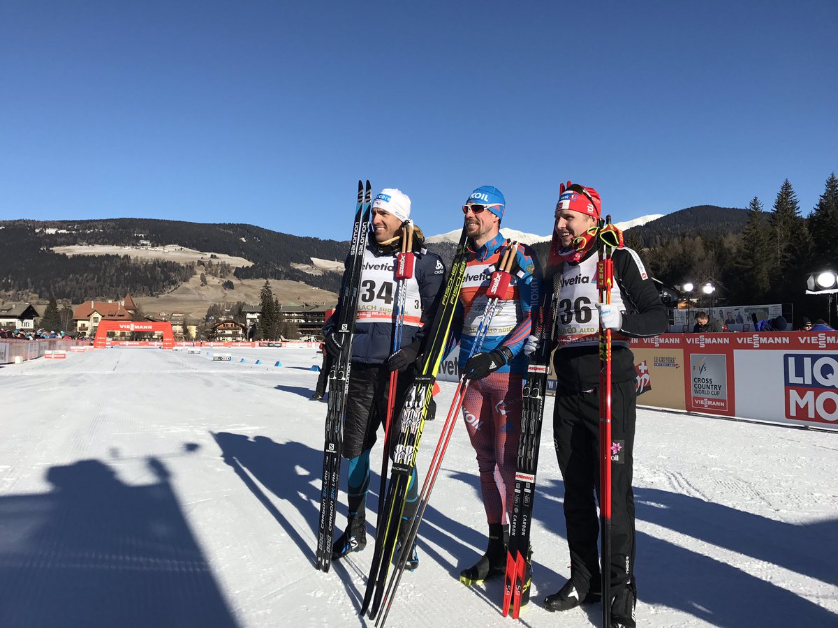 Sergey Ustiugov of Russia topped the podium for a fifth straight stage of the FIS Tour de Ski, winning Friday's 10 k skate by just 0.4 seconds over Maurice Manificat of France (left). Norway's Simen Hegstad Krueger was third. (Photo: FIS Cross Country/twitter)