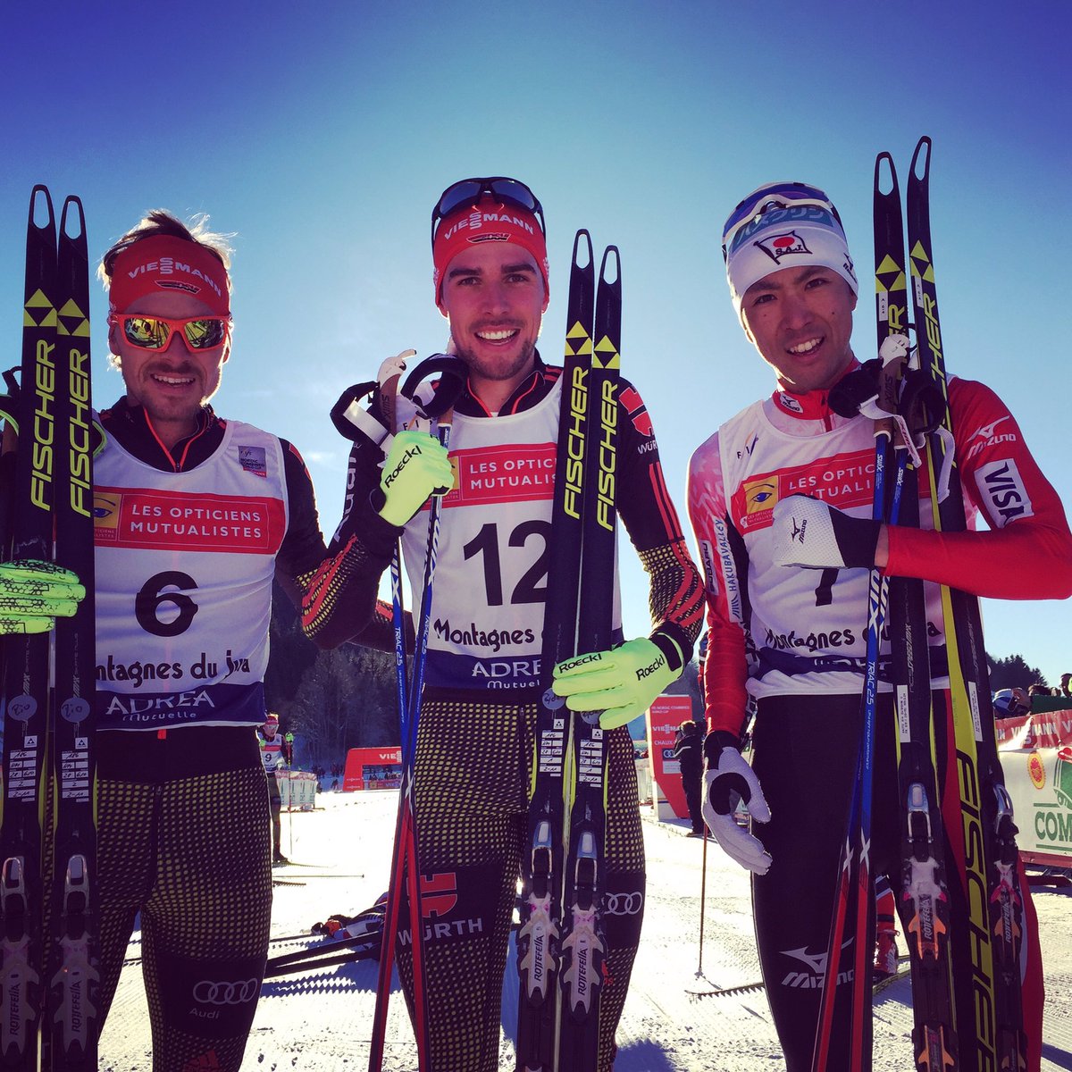 Saturday's Nordic Combined World Cup podium in Chaux-Neuve, France, with German winner Johannes Rydzek (c), German runner-up Fabian Rießle (l) and Japan’s Akito Watabe (r) in third. (Photo: FIS Nordic Combined/Twitter)