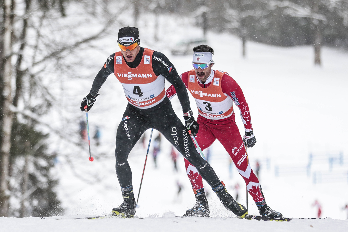 Canada's Alex Harvey chases Dario Cologna of Switzerland during the men's 15-kilometer pursuit on Wednesday in Obsterdorf, Germany. (Photo: Fischer/NordicFocus)
