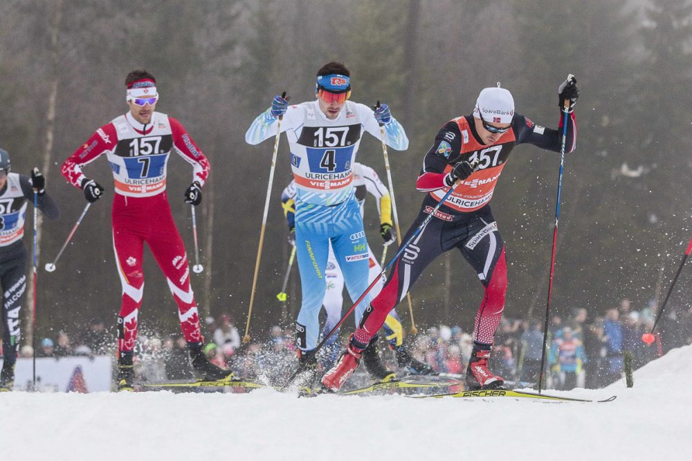 Left to right: Canada's Len Valjas follows Finland's and Norway's Finn Hågen Krogh during the men's 4 x 7.5-kilometer team relay on Sunday in Ulricehamn, Sweden. (Photo: Fischer/Nordic Focus)