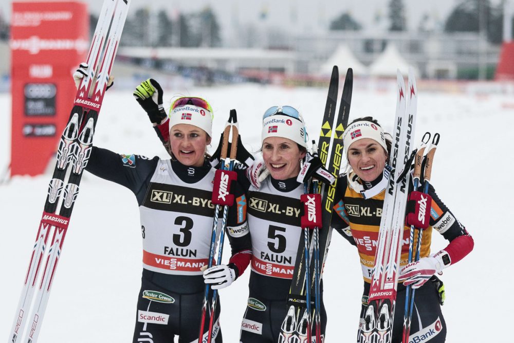 Left to right: Norway's Ingvild Flugstad Østberg, Marit Bjørgen and Heidi Weng celebrate an all-Norwegian podium in the women's 15-kilometer classic mass start on Sunday at the World Cup in Falun, Sweden. (Photo: Fischer/NordicFocus)
