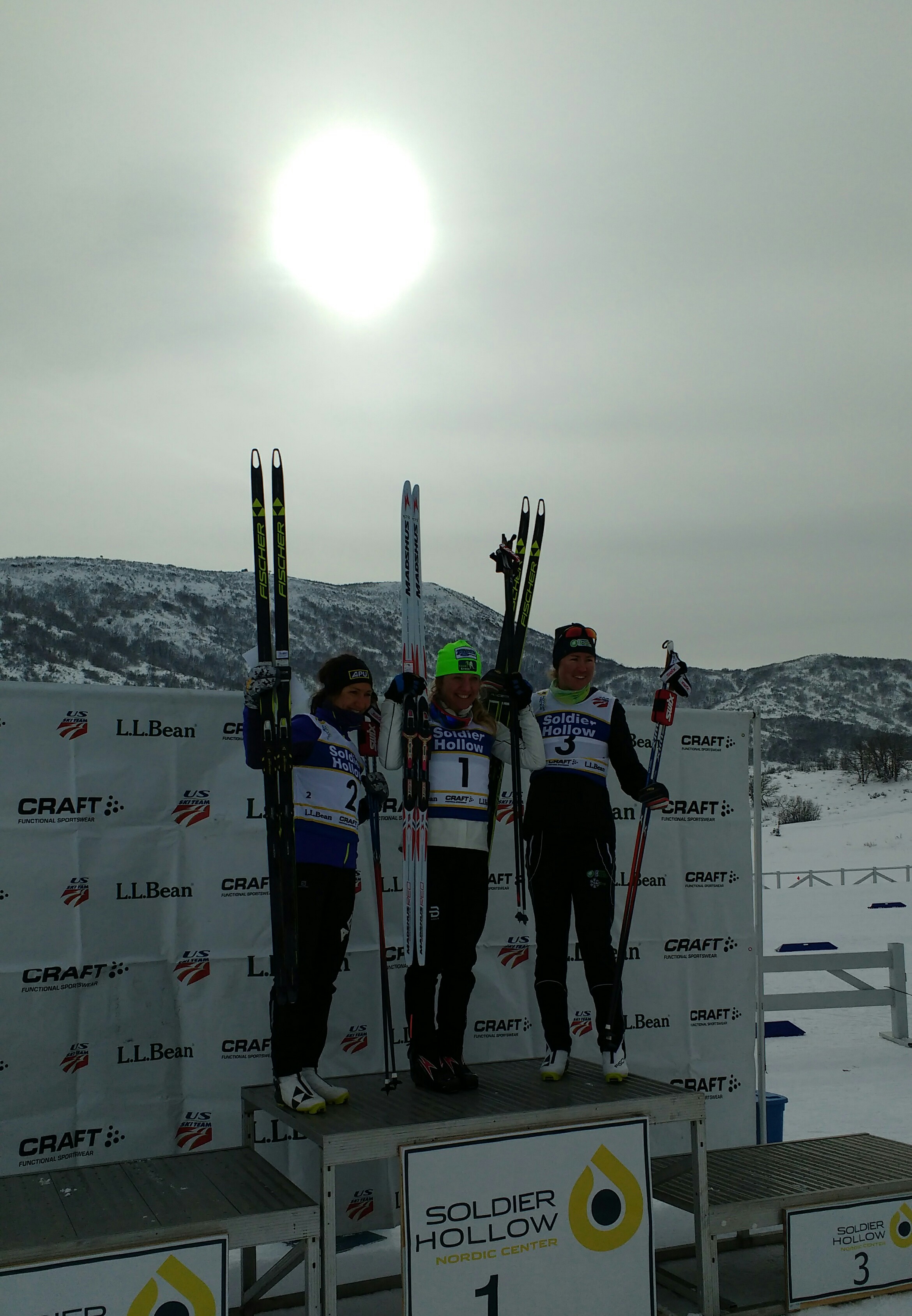 Left to right: Chelsea Holmes, Caitlin Gregg, and Caitlin Patterson standing on top of the podium for the women's 10-kilometer freestyle event at the 2017 U.S. Cross Country Championships at Soldier Hollow in Midway, Utah. 