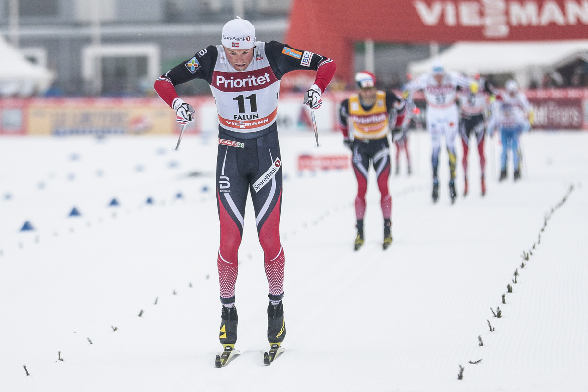 Norway's Emil Iversen double poling to a decisive victory on Sunday, ahead of Norway's Martin Johnsrud Sundby (yellow bib) and Sweden's Calle Halfvarsson (in white) in the World Cup men's 30 k classic mass start in Falun, Sweden. (Photo: Fischer/NordicFocus)