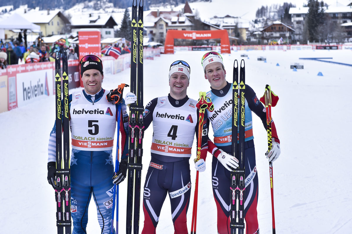 The men's freestyle sprint podium at Saturday's World Cup in Toblach, Italy, with American Simi Hamilton (l) in second, Norway's Sindre Bjørnestad Skar (c) in first and Norway's Johannes Høsflot Klæbo (r) in third. (Photo: Fischer/NordicFocus)