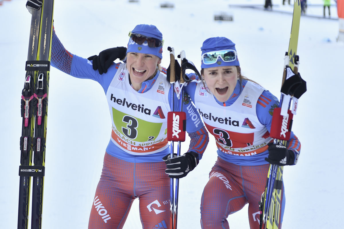 Russia's Natalia Matveeva (l) and Yulia Belorukova celebrating Belorukova's first World Cup victory and Matveeva's second-straight win after Sunday's freestyle team sprint in Toblach, Italy. (Photo: Fischer/NordicFocus)