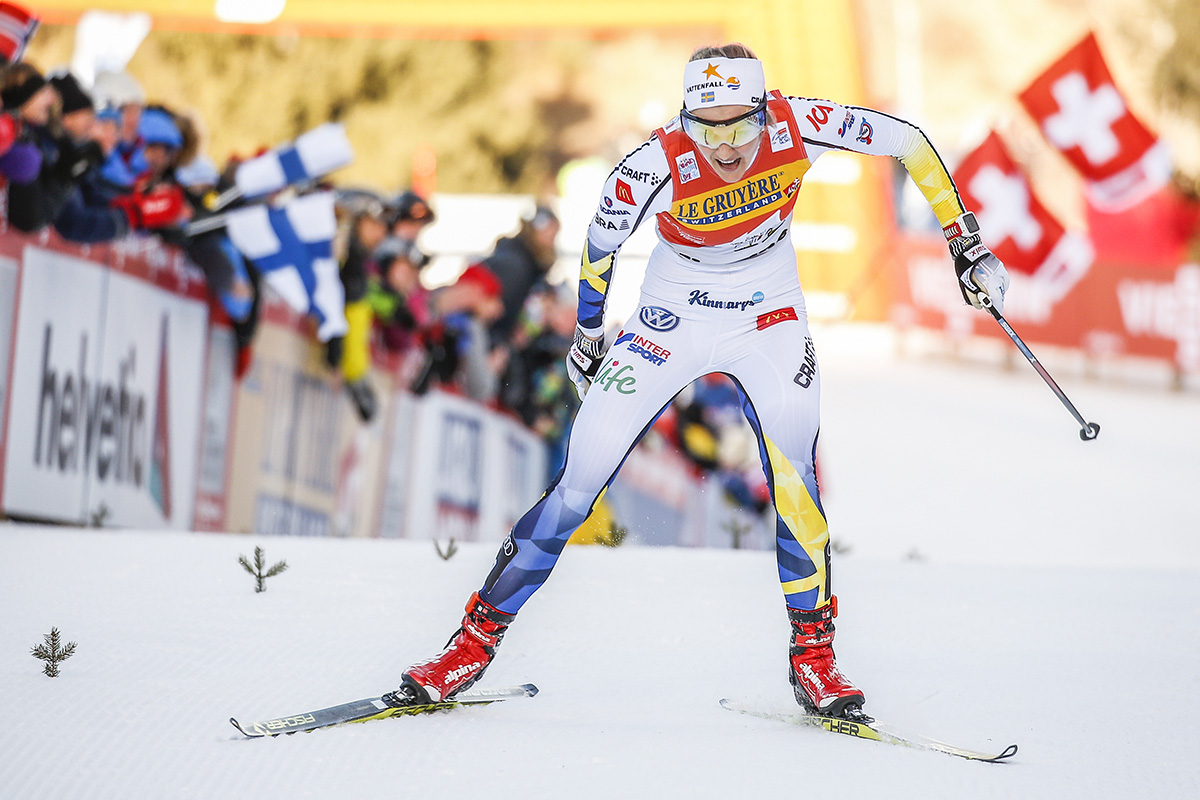 Sweden's Stina Nilsson racing to third in the final climb of the 2017 Tour de Ski up Alpe Cermis in Val di Fiemme, Italy. (Photo: Fischer/NordicFocus)