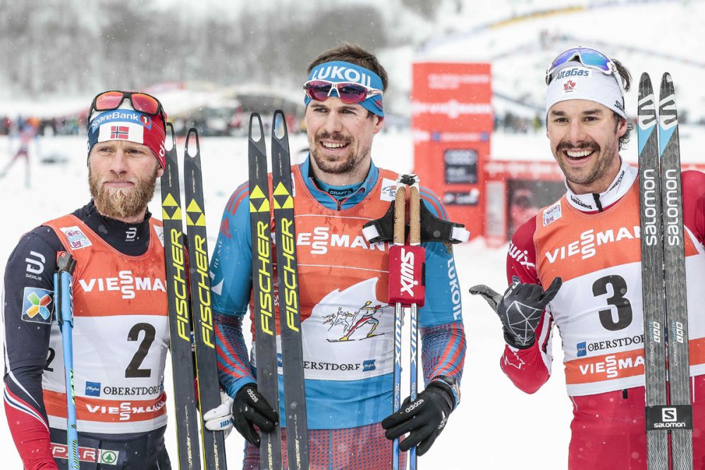 Left to right: Norway's Martin Johnsrud Sundby, Russia's Sergey Ustiugov and Canada's Alex Harvey on the podium for the men's 15-kilometer pursuit on Wednesday in Obsterdorf, Germany. (Photo: Fischer/NordicFocus)