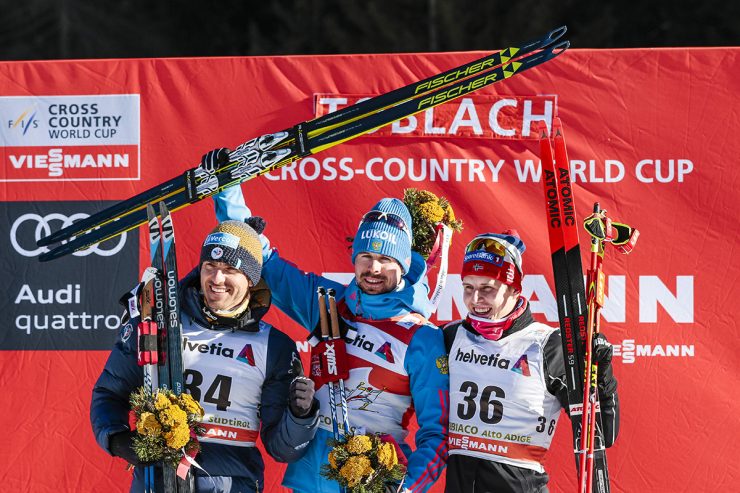 Sergey Ustiugov of Russia topped the podium for a fifth straight stage of the FIS Tour de Ski, winning Friday's 10 k skate by just 0.4 seconds over Maurice Manificat of France (left). Norway's Simen Hegstad Krueger was third. (Photo: Fischer/Nordic Focus)