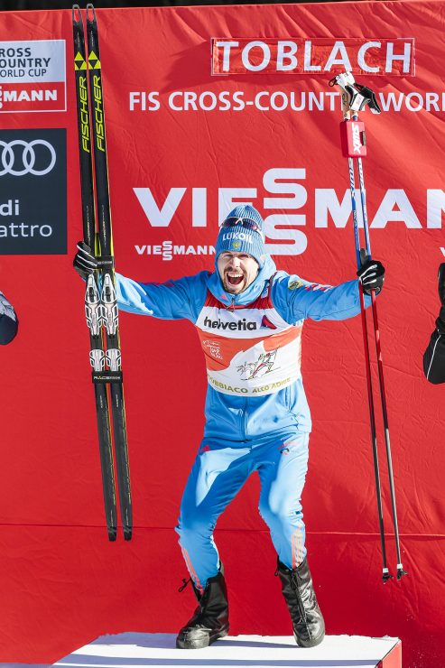 Ustiugov (RUS) was extremely excited to capture another Tour de Ski stage win in Toblach (ITA).  (Photo: Fischer/Nordic Focus)