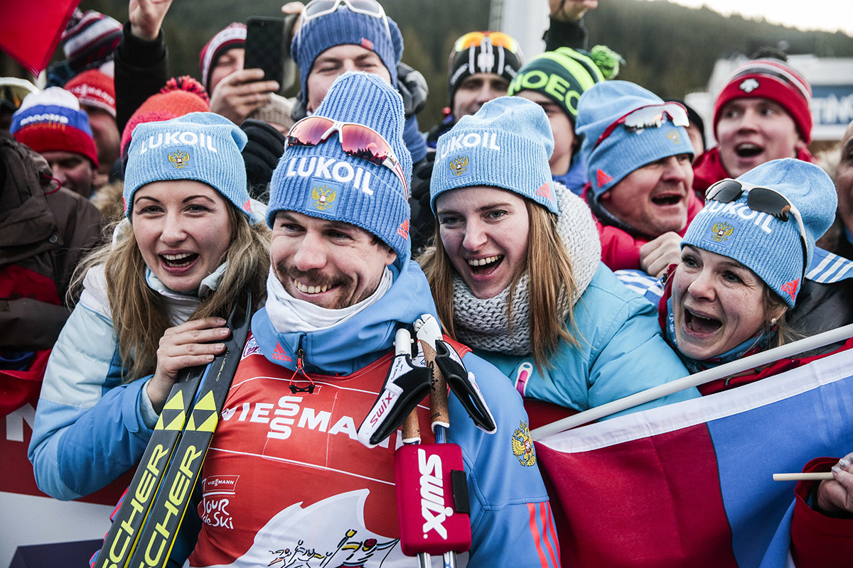 Russia's Sergey Ustiugov celebrates with his supporters after winning the final climb and his first Tour de Ski overall title on Sunday at Alpe Cermis in Val di Fiemme, Italy. (Photo: Fischer/Nordic Focus)
