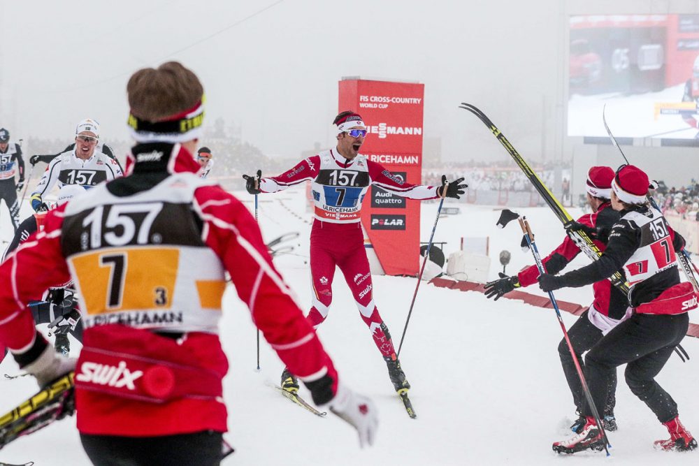 Len Valjas (c) spreads his arms to greet his teammates Alex Harvey (far right), Knute Johnsgaard (far left) and Devon Kershaw after he crossed third in the men's 4 x 7.5-kilometer team relay on Sunday in Ulricehamn, Sweden. (Photo: Fischer/Nordic Focus)