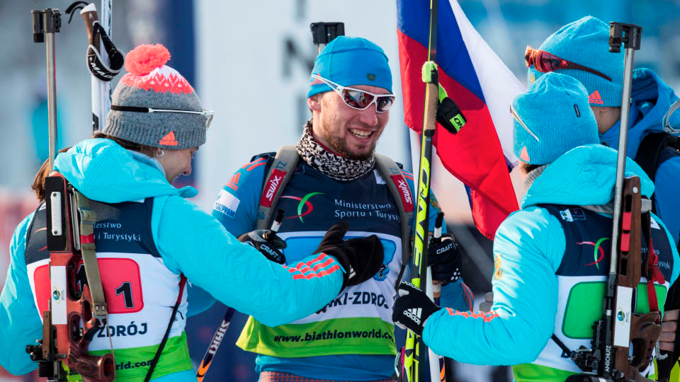 Russia’s Alexander Loginov (center) is greeted at the finish by his teammates Irina Starykh, Svetlana Sleptsova and Alexey Volkov after anchoring his team to the gold medal in the mixed relay at the 2017 IBU Open European Championships in Duszniki-Zdrój, Poland. (Photo: IBU)