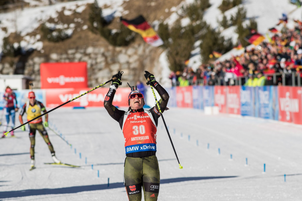 Germany’s Nadine Horchler celebrates her first career victory in the women’s 12.5-k mass start on Saturday at the 2017 IBU World Cup in Antholz, Italy, after distancing herself from teammate Laura Dahlmeier (yellow bib) and the Czech Republic’s Gabriela Koukalová (far left). (Photo: IBU/Christian Manzoni) 