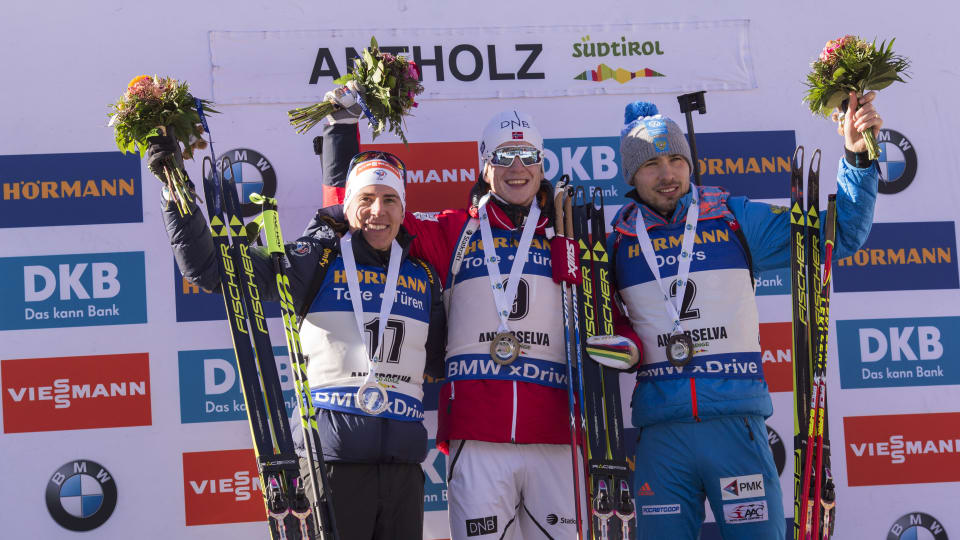 The men's 15 k mass start podium at the IBU World Cup on Sunday in Antholz, Italy, with Norway's Johannes Thingnes Bø (c) in first, France's Quentin Fillon Maillet (l) in second, and Russia's Anton Shipulin (r) in third. (Photo: IBU)