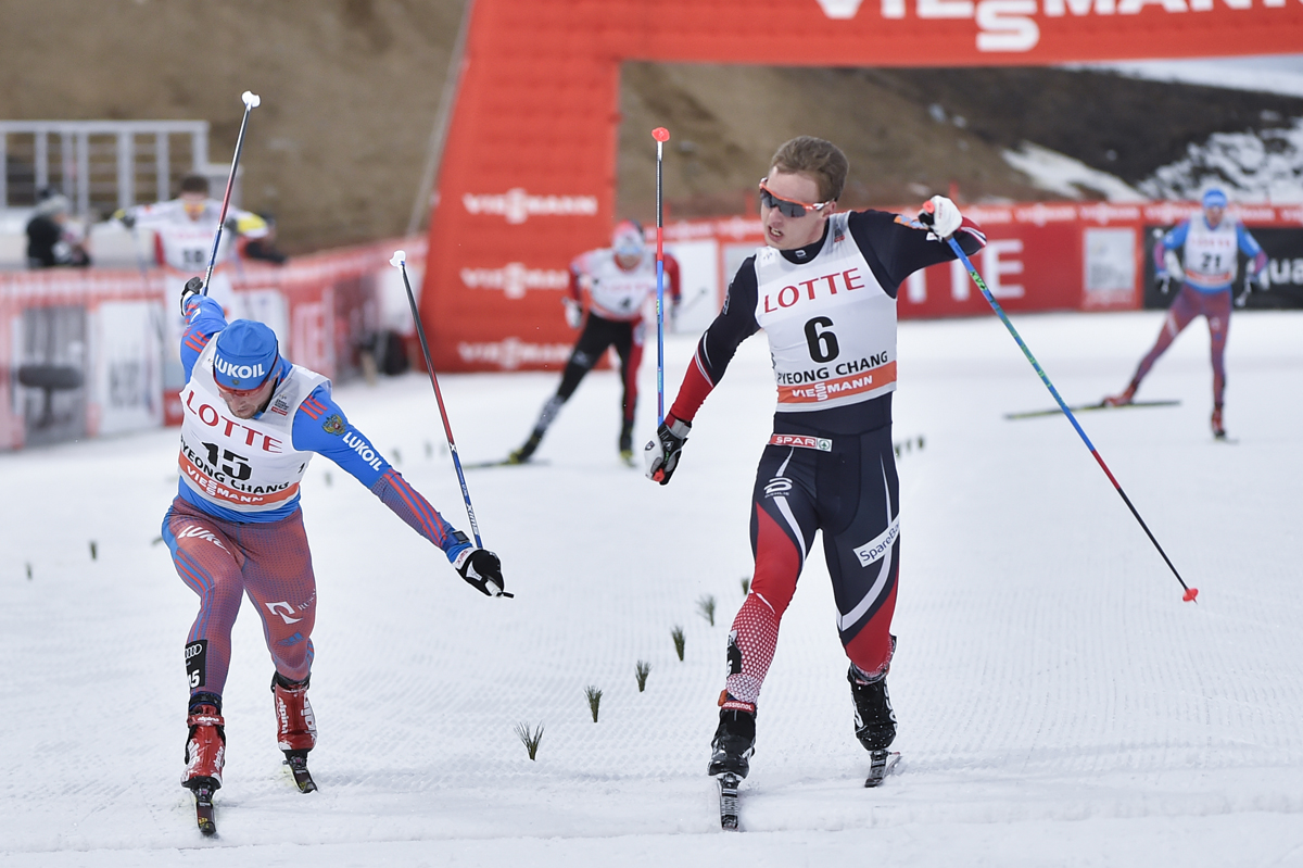 Norway's Mathias Rundgreen (6) outlunging Russia’s Konstantin Glavatskikh (l) for third in the men's 30 k skiathlon on Saturday at the PyeongChang World Cup in South Korea. (Photo: Fischer/NordicFocus)