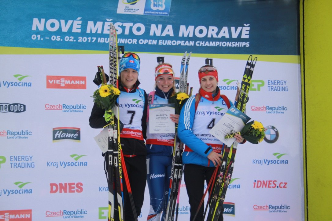Megan Bankes of Canada (left) on the podium after the IBU Junior Cup pursuit in Nove Mesto, Czech Republic. (Photo: IBU/Twitter)