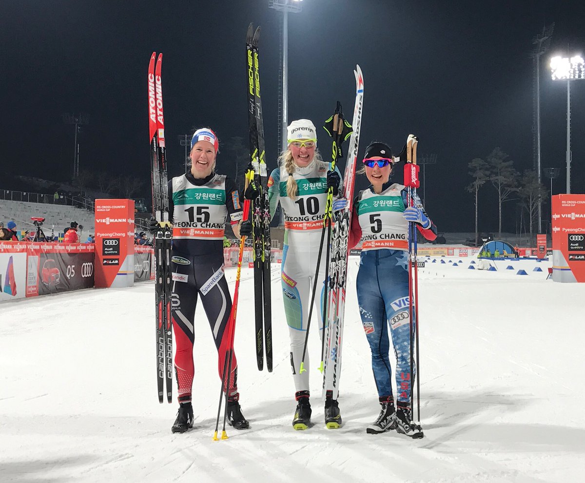 The women's 1.4 k classic sprint podium on Friday at the pre-Olympic PyeongChang World Cup in South Korea, with Slovenia's Anamarija Lampič (c) in first, Norway’s Silje Øyre Slind (l) in second, and American Ida Sargent (r) in third. It was the first time on the World Cup podium for all three athletes. (Photo: FIS Cross-Country/Twitter)