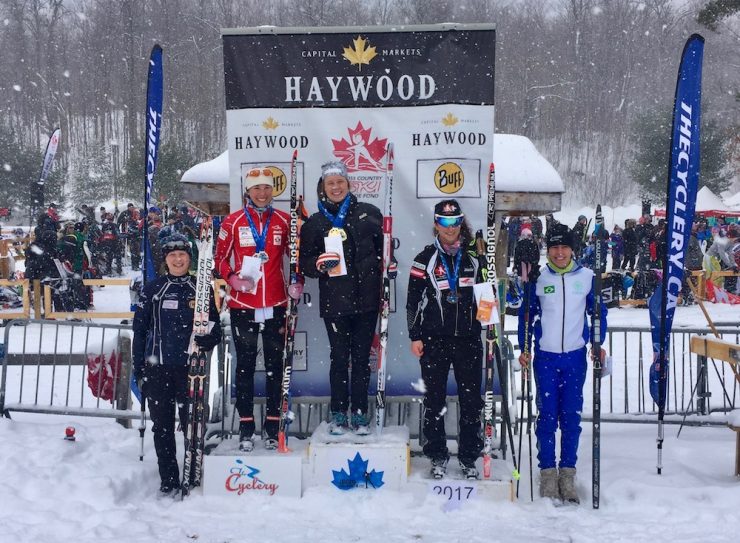 The snow kept falling on the open women's podium. Left to right: Andrea Dupont, Maya MacIsaac-Jones, Anne Hart, Sophie Carrier-Laforte, and Jacqueline Mourao. (Photo: Rob Smith)
