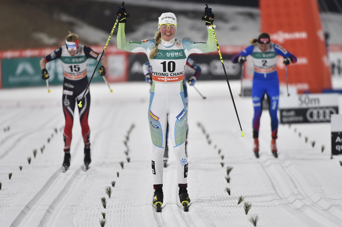 Slovenia's Anamarija Lampic (10) celebrating her first World Cup victory and podium on Friday in the as she wins the women's 1.4 k classic sprint final in PyeongChang, South Korea. (Photo: Fischer/Nordic Focus)