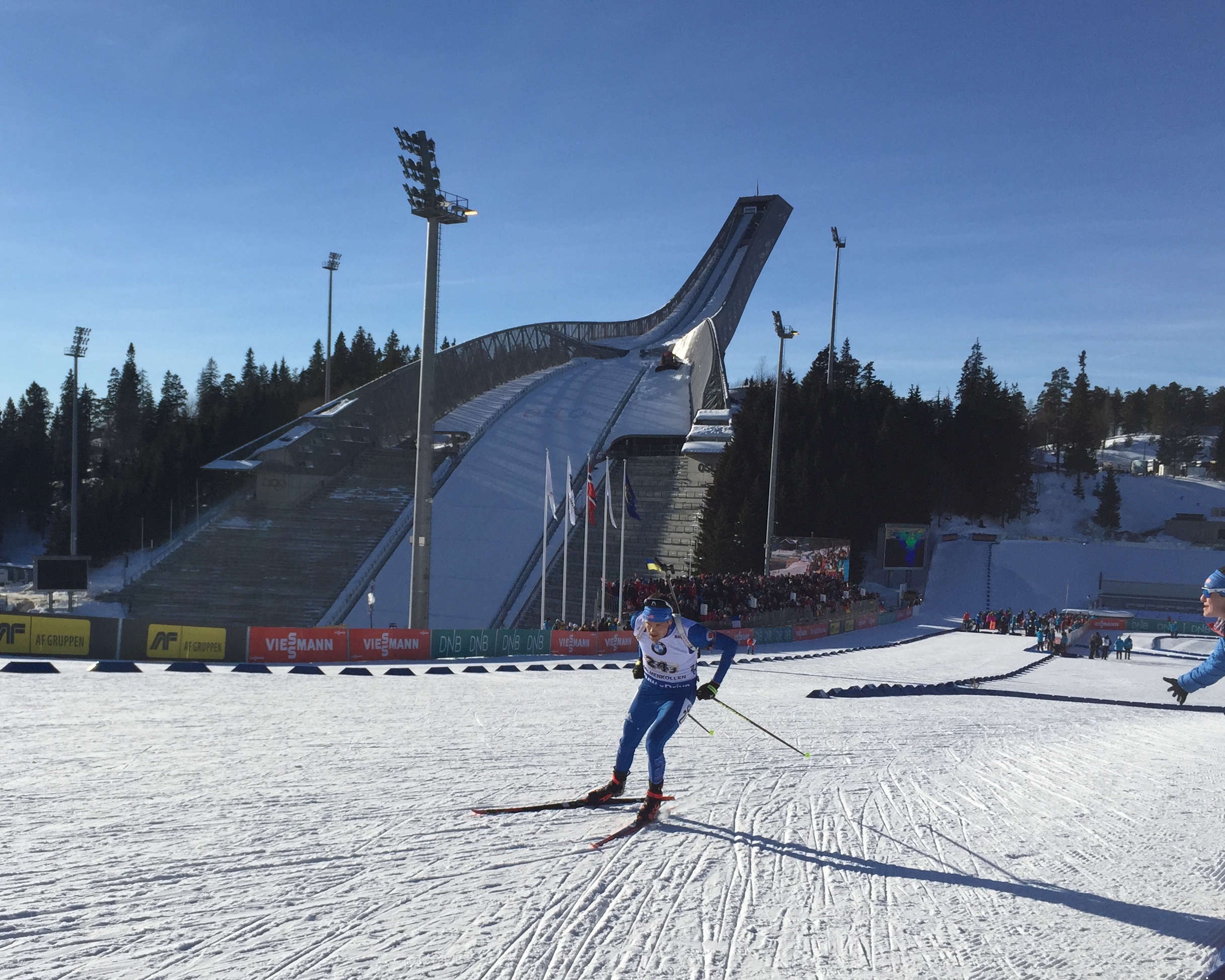 Clare Egan cheers on Tim Burke in the final World Cup race of his career, racing the third leg of the U.S. men's relay in Oslo.