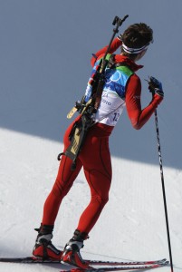 Ole Einar Bjoerndalen waiting for Sergey Novikov (BLR) to finish his last loop during the individual race at the 2010 Olympics.