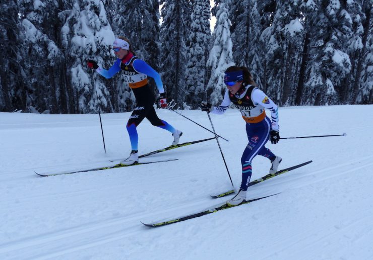 CNST teammates Dahria Beatty (l) and Katherine Stewart-Jones charge the last hill of the 10km on their way to 6th and 1st respectively. (Photo: Peggy Hung)