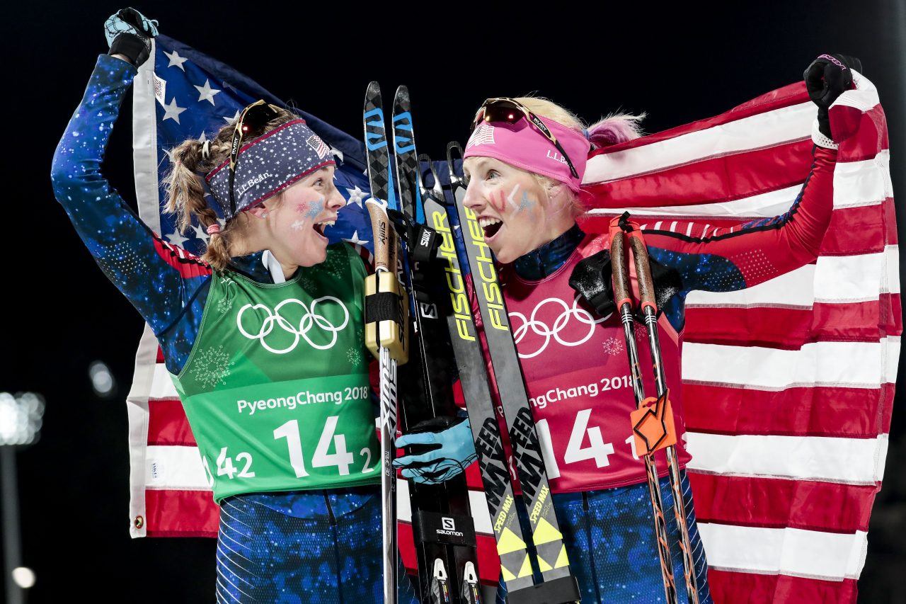 Jessie Diggins (l) and Kikkan Randall soak up their win in the women's freestyle team sprint on Wednesday at the 2018 Olympics in PyeongChang, South Korea. (Photo: FIS Cross Country/Twitter)