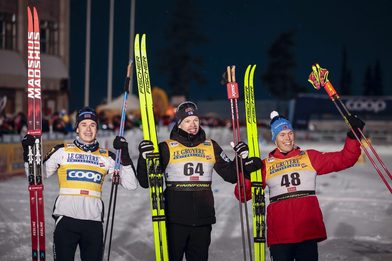 Harald Oestberg Amundsen (NOR), Iivo Niskanen (FIN), and Martin Loewstroem Nyenget (NOR) topped the podium in the Ruka men’s 10 k Classic.  (Photo: NordicFocus)